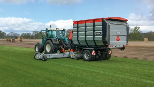 Vacuum sweeper S12 sweeping and collecting grass clippings an a tuf farm