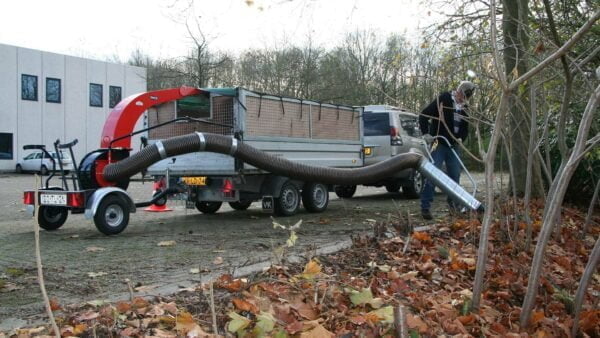 Debris loader for leaves and solid waste mounted on trailer