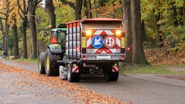 Vacuum trailer sweeping and collecting leaves