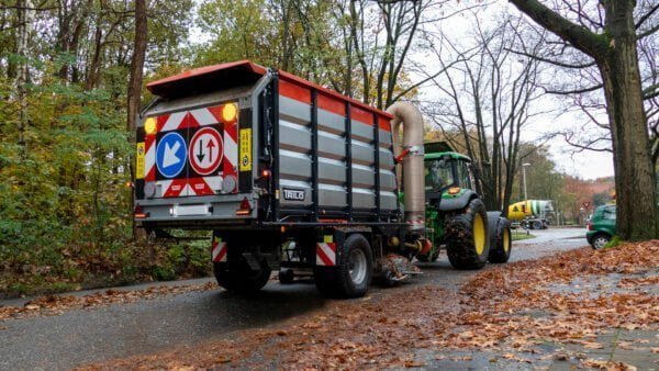 Vacuum trailer sweeping and collecting leaves